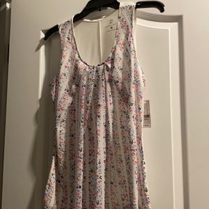 White sleeveless blouse with colored dots